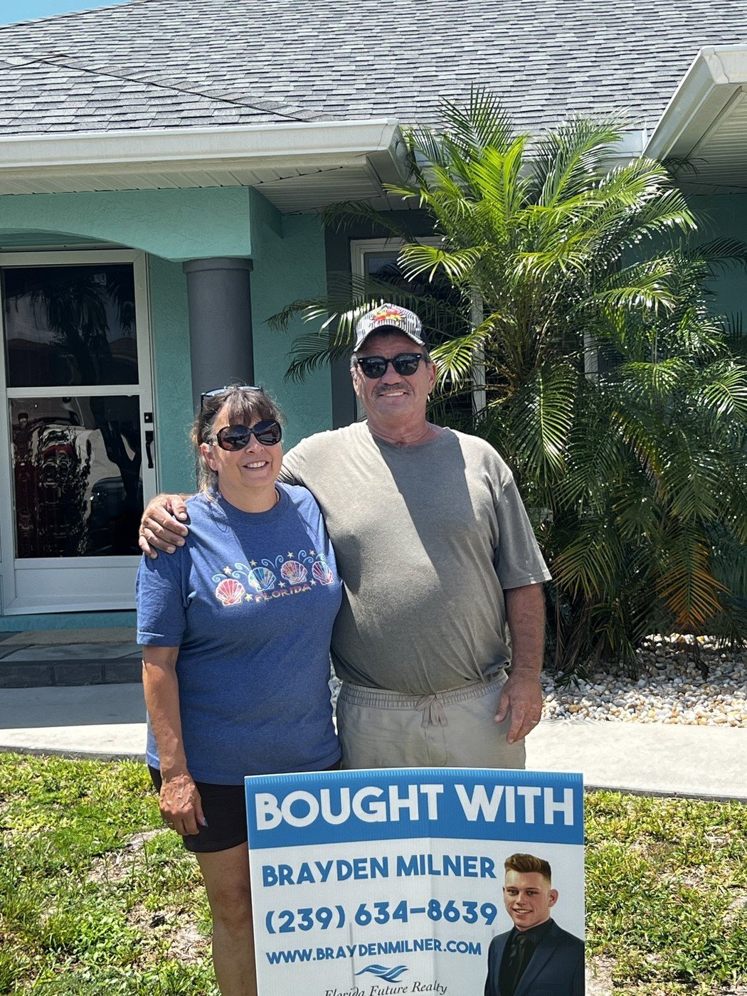 Real Southwest Florida buyers in front of their new home with a &lsquo;Bought With Brayden Milner&rsquo; yard sign