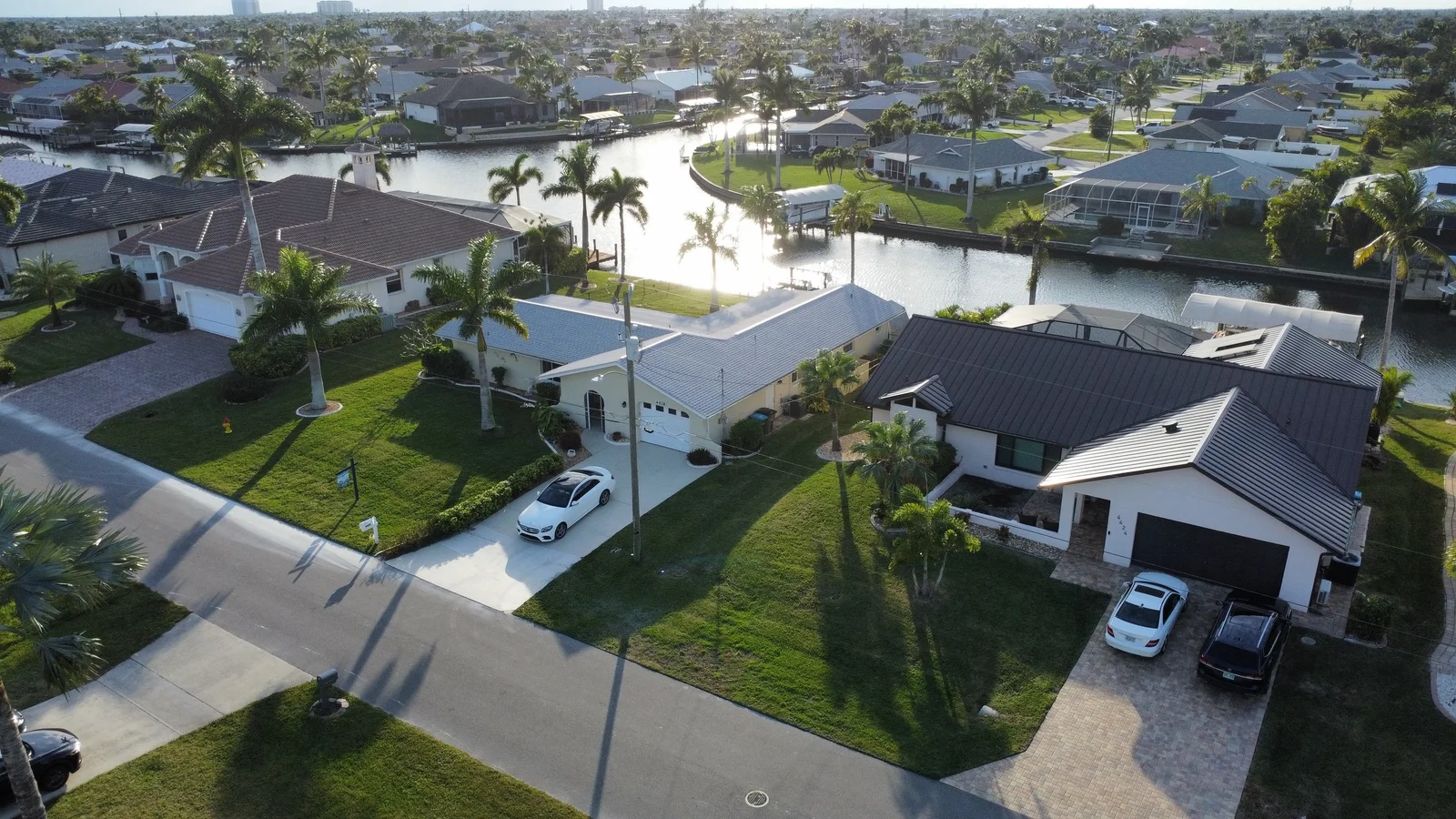 Owned Cape Coral canal aerial at golden hour