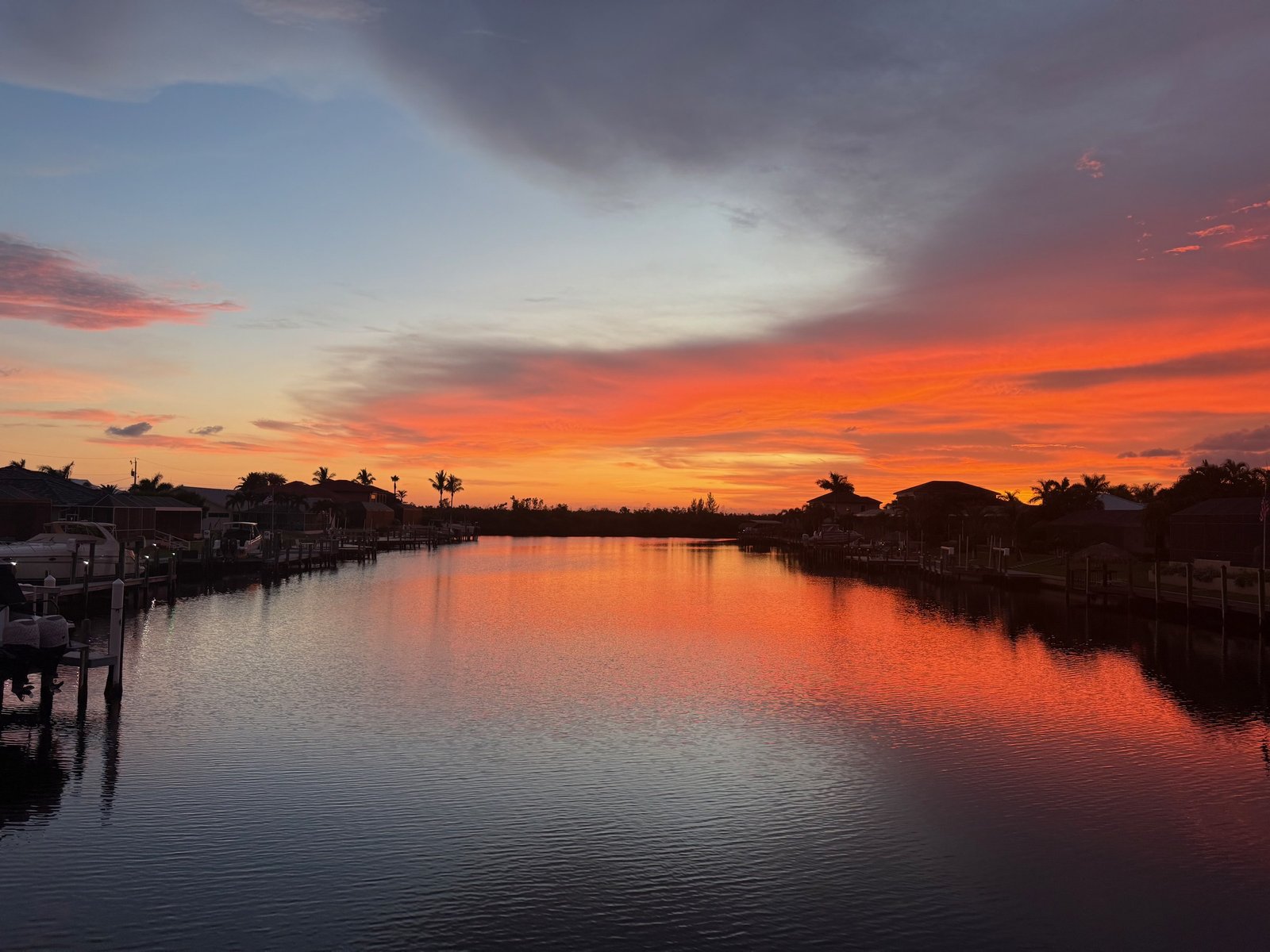 Aerial view of a Southwest Florida gulf-access canal at sunset