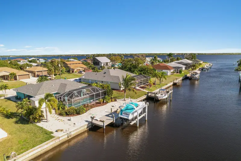 Aerial view of a Cape Coral canal running toward the river