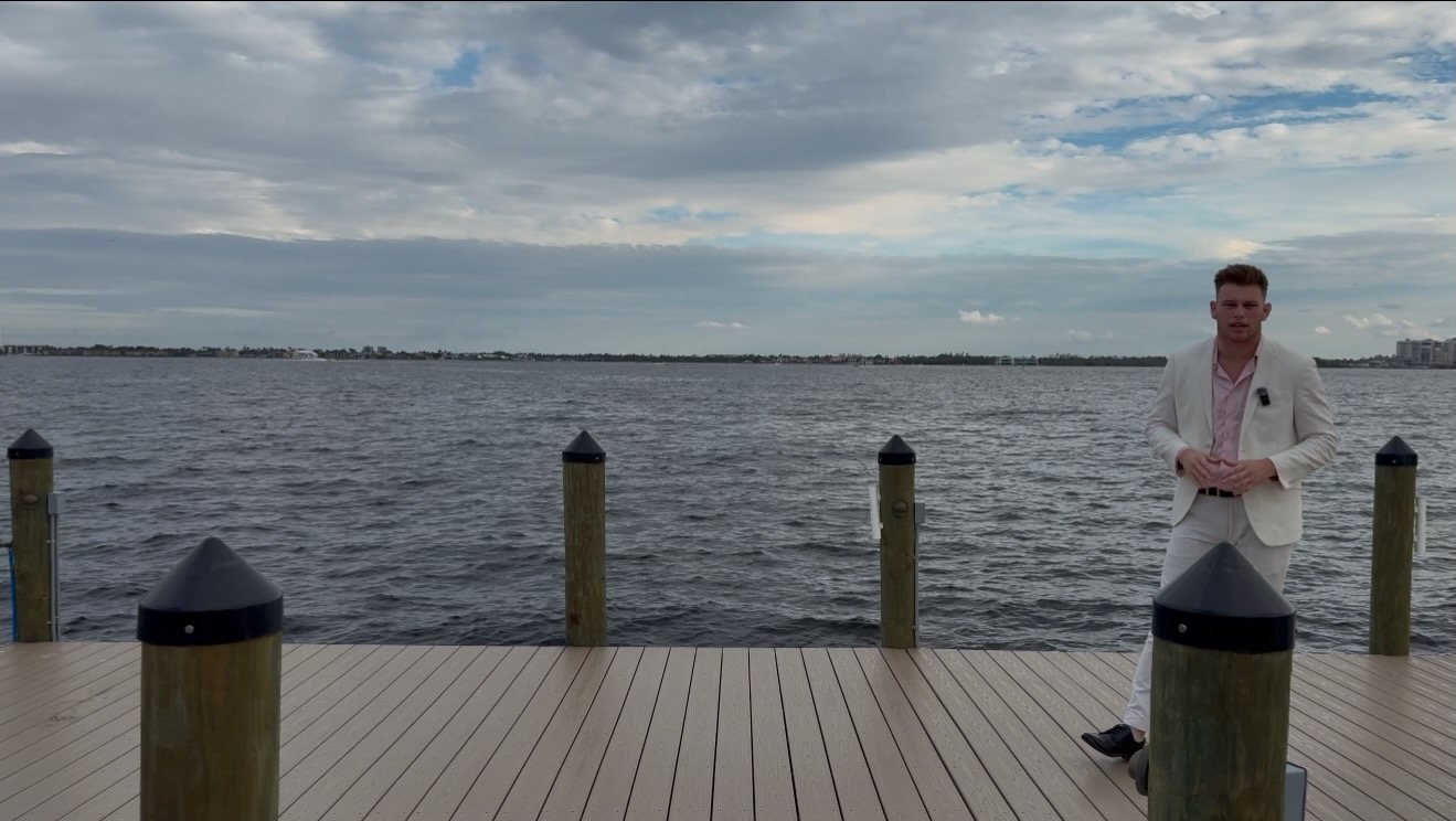Brayden Milner on a dock overlooking a Southwest Florida bay
